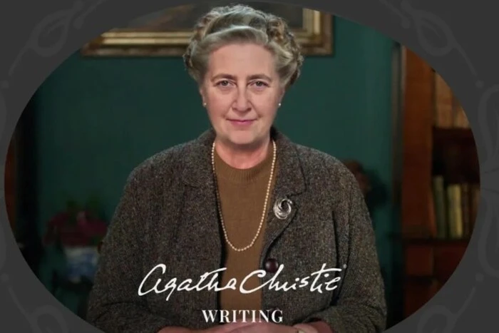 Agatha Christie with a book in her hands
